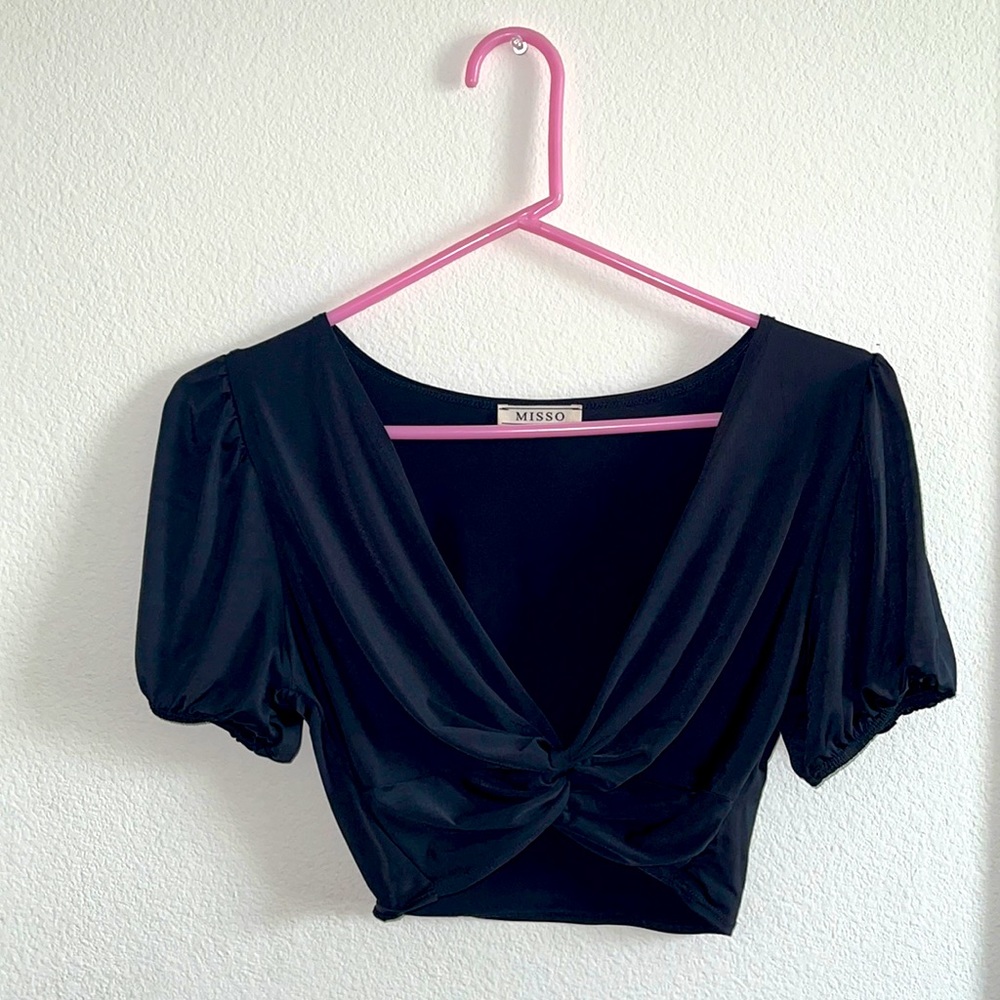 Black crop top with cute little knot in the front.
